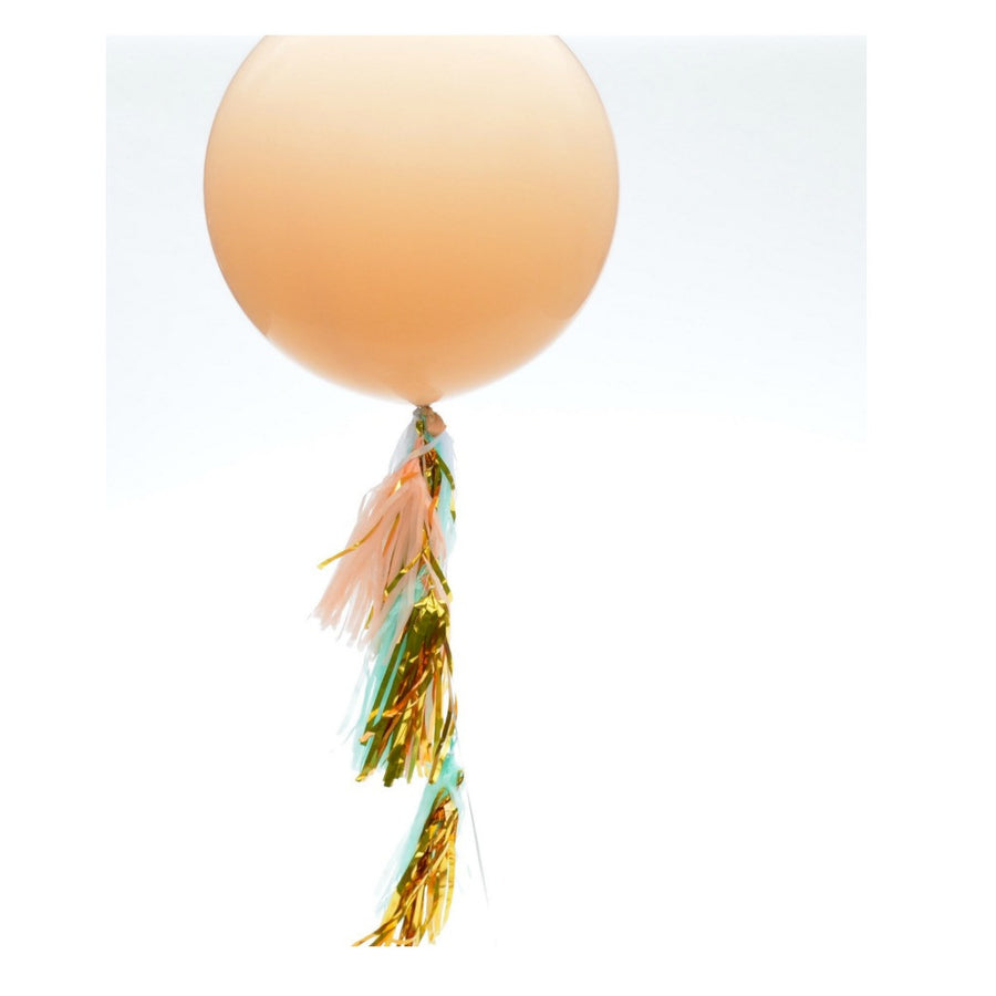peach balloon and tassels